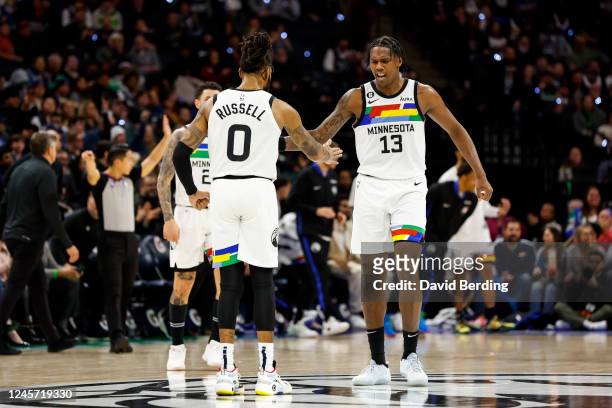 Angelo Russell and Nathan Knight of the Minnesota Timberwolves interact in the fourth quarter of the game against the Chicago Bulls at Target Center...