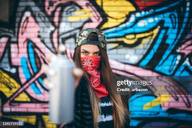 graffiti artist with spray paint - grafitti artist stock pictures, royalty-free photos & images