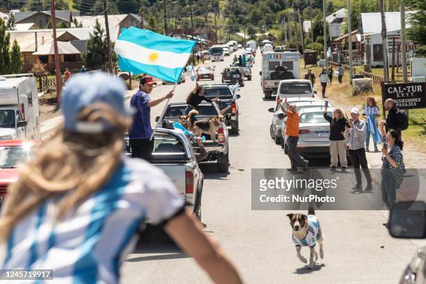 Local Argentinians and tourists are celebrating the victory of the World Cup final match against France in the streets of El Chalten, Argentina, on...