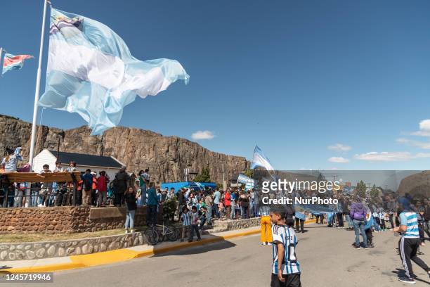Local Argentinians and tourists are celebrating the victory of the World Cup final match against France in the streets of El Chalten, Argentina, on...