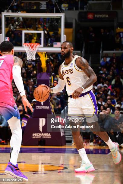 LeBron James of the Los Angeles Lakers handles the ball during the game against the Washington Wizards on December 18, 2022 at Crypto.Com Arena in...