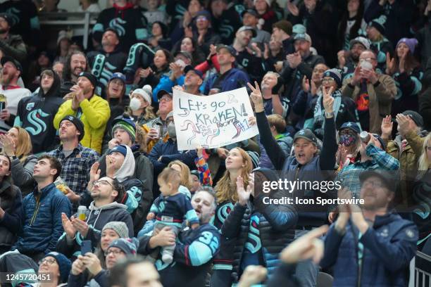 Kraken fans celebrate a Seattle goal during an NHL game between the Winnipeg Jets and the Seattle Kraken on December 18, 2022 at Climate Pledge Arena...