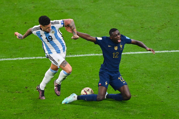 Nicolas OTAMENDI of Argentina commit a fault on Randal KOLO MUANI of France during the FIFA World Cup 2022 Final between Argentina and France at...