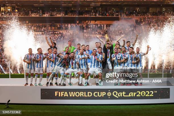 Lionel Messi of Argentina lifts the FIFA World Cup Trophy after winning the FIFA World Cup Qatar 2022 during the FIFA World Cup Qatar 2022 Final...