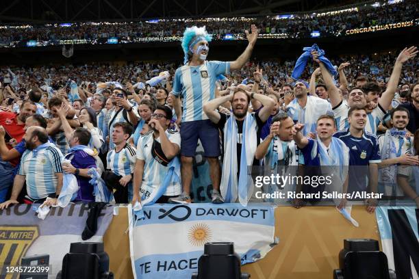 Argentina fans celebrate after winning the FIFA World Cup Qatar 2022 Final match between Argentina and France at Lusail Stadium on December 18, 2022...