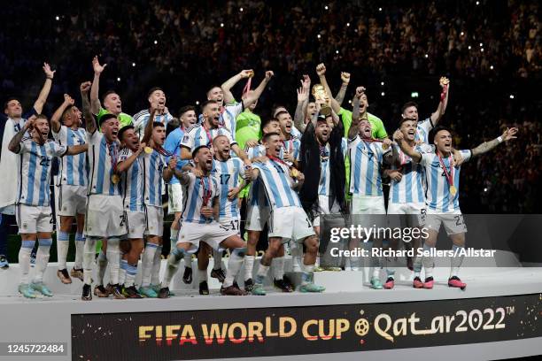 Lionel Messi of Argentina and team celebrate after winning the FIFA World Cup Qatar 2022 Final match between Argentina and France at Lusail Stadium...