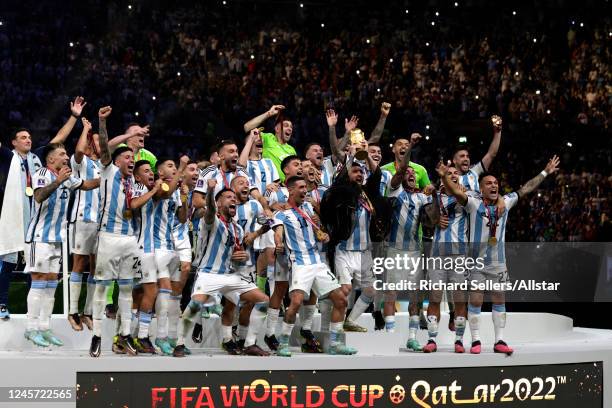 Lionel Messi of Argentina and team celebrate after winning the FIFA World Cup Qatar 2022 Final match between Argentina and France at Lusail Stadium...