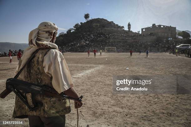 File photo dated March 30, 2017 shows Yemeni security forces standing guard during the Taiz Amateur League final match between Al Ssumud and Al...