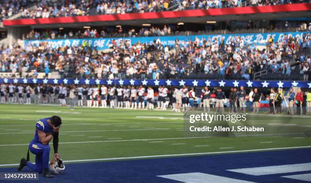 Inglewood, CA Chargers cornerback Bryce Callahan kneels in prayer before a game with he. Tennessee Titans at SoFi Stadium in Inglewood Sunday, Dec....