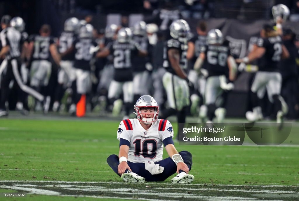 New England Patriots QB Mac Jones sits on the field with his eyes News  Photo - Getty Images
