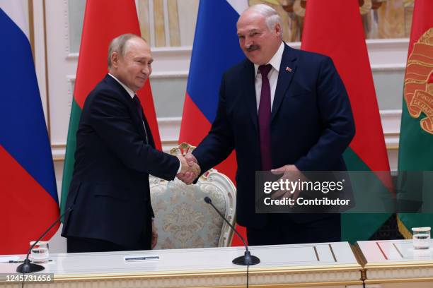 Russian President Vladimir Putin and Belarussian President Alexander Lukashenko shake hands at their joint press conference at the Palace of...