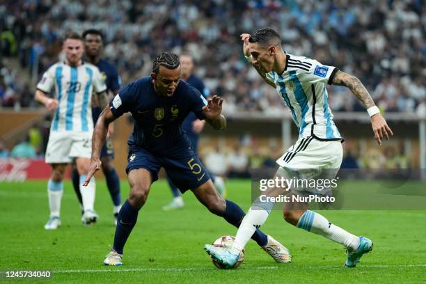 Jules Kounde centre-back of France and FC Barcelona and Angel Di Maria right winger of Argentina and Juventus FC compete for the ball during the FIFA...