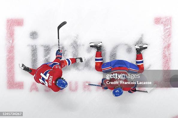 Ghule Arber Xhekaj and Kaiden Guhle of the Montreal Canadiens stretche ...
