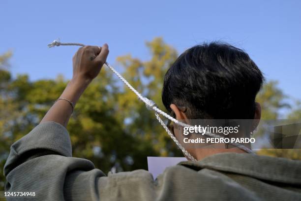 People take part in a protest against the execution of Iranian footballer Amir Nasr-Azadani -sentenced to death within protests following the death...