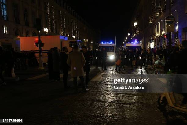 Police take security measures as fans wait for the arrival of the French national football team at Concorde Square, a day after the Qatar 2022 World...