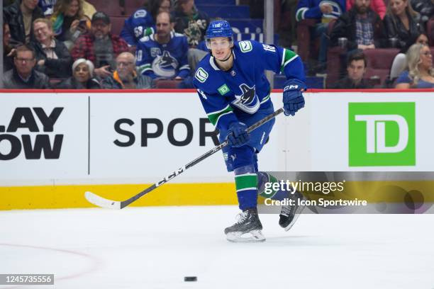 Vancouver Canucks right wing Jack Studnicka skates up ice during their NHL game against the Winnipeg Jets at Rogers Arena on December 17, 2022 in...