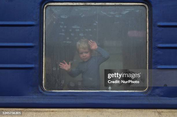 Young boy looks out the window of an evacuation train from Kherson to Khmelnytskyi at Kherson station, on Sunday, December 18, 2022. Five weeks after...