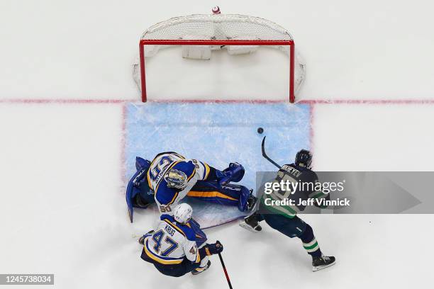 Ilya Mikheyev of the Vancouver Canucks scores on Jordan Binnington of the St. Louis Blues during the second period of their NHL game at Rogers Arena...