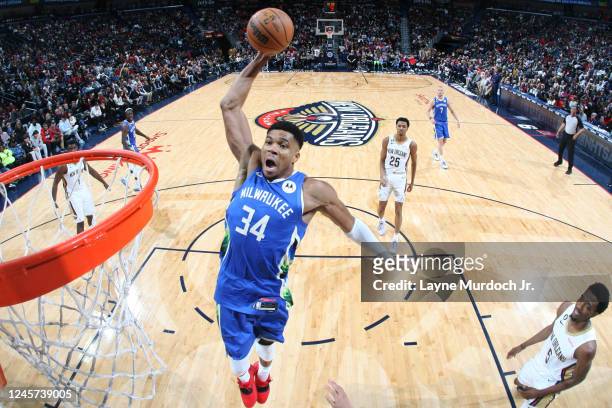 Giannis Antetokounmpo of the Milwaukee Bucks dunks the ball during the game against the New Orleans Pelicans on December 19, 2022 at the Smoothie...