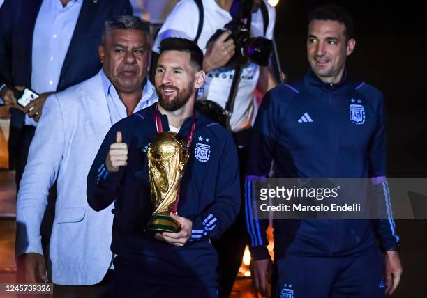 Lionel Messi of Argentina holds the FIFA World Cup during the arrival of the Argentina men's national football team after winning the FIFA World Cup...