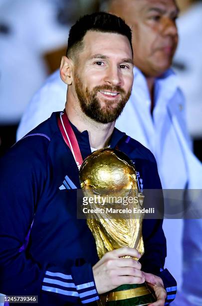 Lionel Messi holds the FIFA World Cup during the arrival of the Argentina men's national football team after winning the FIFA World Cup Qatar 2022 on...