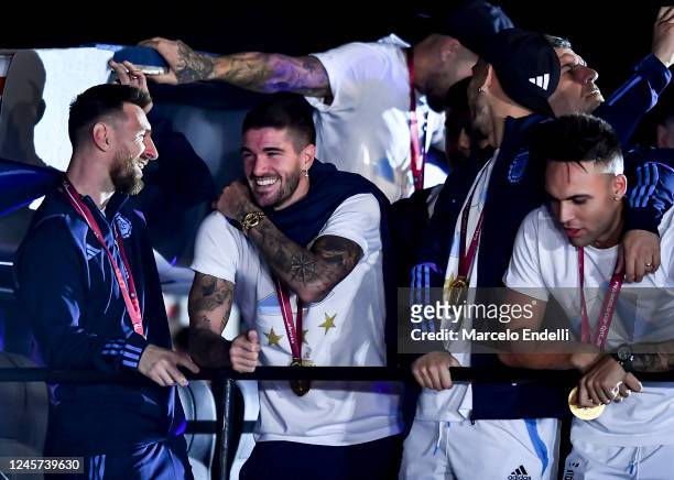 Lionel Messi and teammate Rodrigo De Paul smiles during the arrival of the Argentina men's national football team after winning the FIFA World Cup...