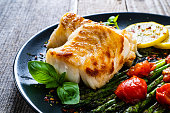 Fried cod fillet with fresh vegetables