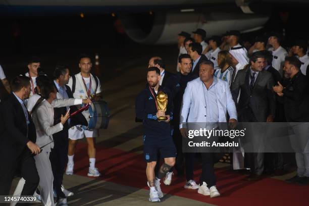 Lionel Messi and coach Lionel Escaloni arrive with the world champion squad at Ezeiza Airport this morning in Buenos Aires Argentina, on December 20,...