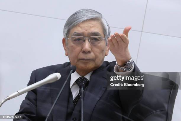 Haruhiko Kuroda, governor of the Bank of Japan , takes a question from members of the media during a news conference at the central bank's...