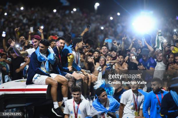 Lionel Messi of Argentina smiles to the fans during the caravan of the Argentina men's national football team after winning the FIFA World Cup Qatar...