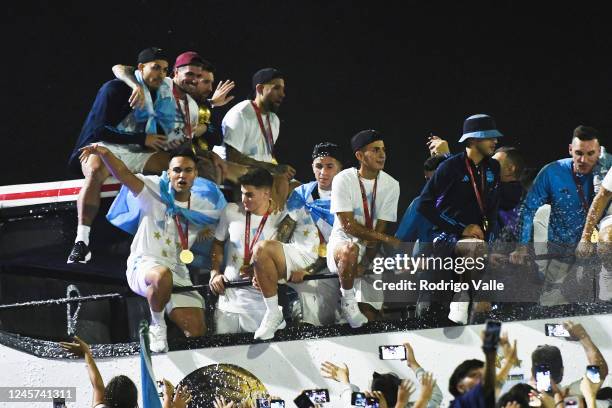 Lautaro Martinez, Julian Alvarez and Enzo Fernandez of Argentina celebrate with the fans during the arrival of the Argentina men's national football...