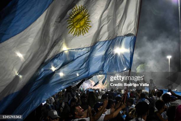 Fans of Argentina celebrate outside Argentina's training ground before the arrival of the Argentina men's national football team after winning the...