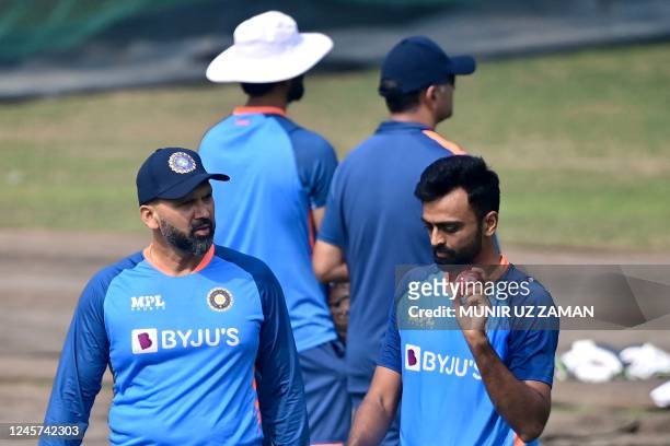 India's bowling coach Paras Mhambrey talks to Jaydev Unadkat during a practice session at the Sher-e-Bangla National Cricket Stadium in Dhaka on...