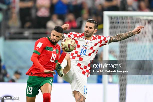 Youssef En-Nesyri of Morocco and Marko Livaja of Croatia battle for the ball during the FIFA World Cup Qatar 2022 3rd Place match between Croatia and...