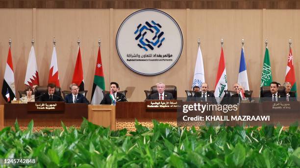 French President Emmanuel Macron, Jordan's Crown Prince Hussein and his father King Abdullah II, Iraqi Prime Minister Mohamed Shia al-Sudani, along...