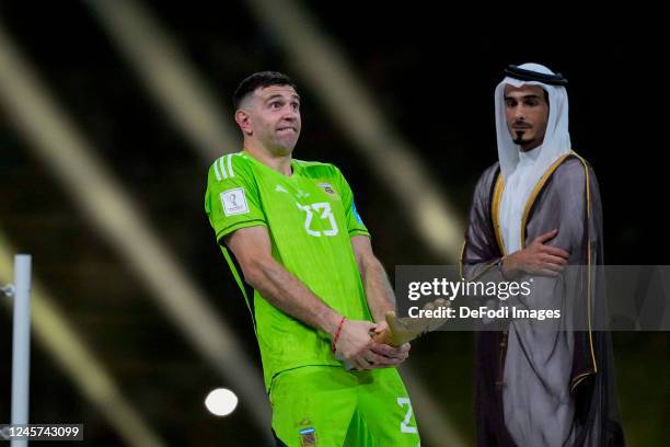 Goalkeeper Emiliano Martinez of Argentina posing with his award as Penis after the FIFA World Cup Qatar 2022 Final match between Argentina and France...