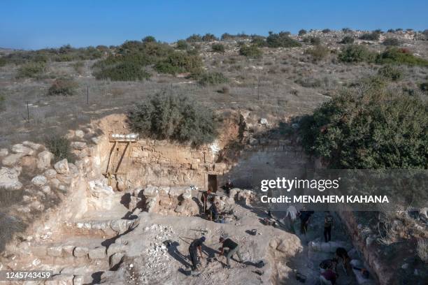 An aerial photo shows Israeli archaeologists working outside the Tomb of Salome in the Lachish area in the Judean hills west of Jerusalem, on...