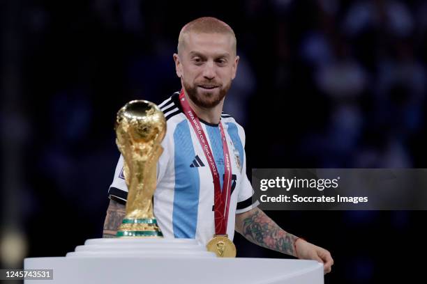 Papu Gomez of Argentina celebrates the World Cup victory with the trophy during the World Cup match between Argentina v France at the Lusail Stadium...