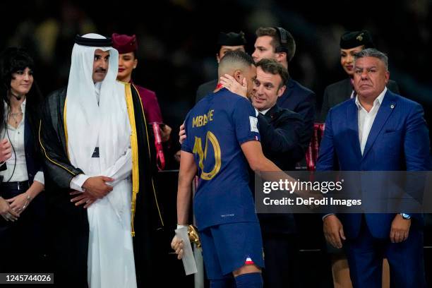 Hamad bin Khalifa Al Thani , President Emanuel Macron of France and Kylian Mbappe of France look on after the FIFA World Cup Qatar 2022 Final match...