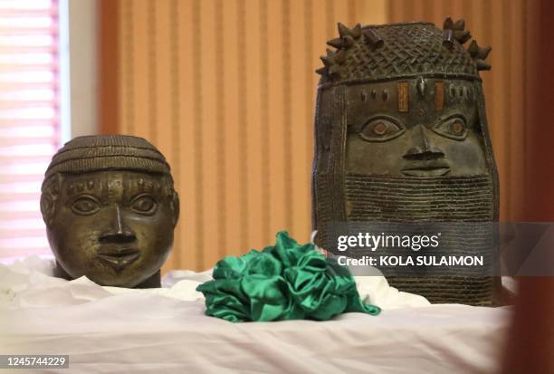 This December 20, 2022 image taken at the Nigerian Ministry of Foreign Affairs in Abuja shows Benin bronze artefacts, part of some of the housands of...
