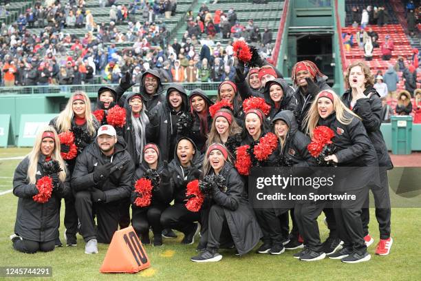 Louisville Cardinals cheerleaders pose for a photo during the Wasabi Fenway Bowl between the Cincinnati Bearcats and the Louisville Cardinals on...
