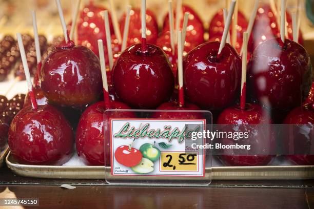 Candy apples on sale at a festive confectionery stall in the Breitscheidplatz Christmas market in Berlin, Germany, on Tuesday, Dec. 20, 2022....