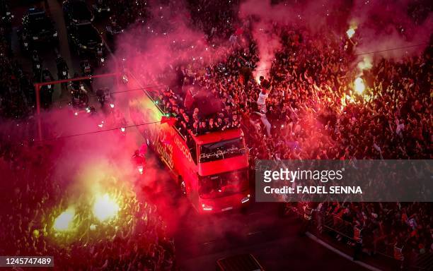 Supporters cheer as Morocco's national football team arrives to the center of the capital Rabat, on December 20 after the Qatar 2022 World Cup.
