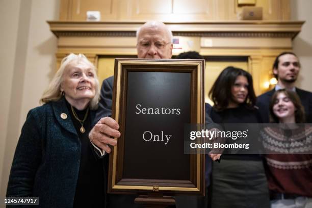 Senate Pat Leahy, a Democrat from Vermont, right, holds a "Senators Only" sign with his wife, Marcelle Pomerleau, after delivering his final floor...