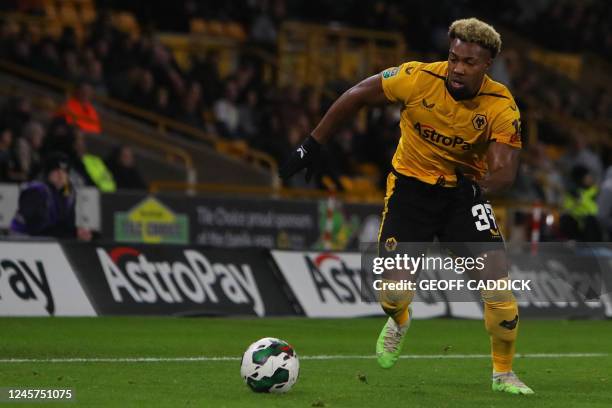 Wolverhampton Wanderers' Spanish midfielder Adama Traore runs with the ball during the English League Cup fourth round football match between...