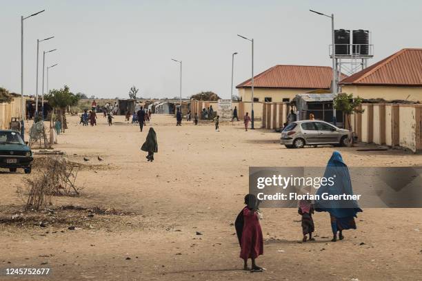 Women and girls are pictured in the capital of the Federal State of Borno on December 19, 2022 in Maiduguri, Nigeria. The region in the north east of...