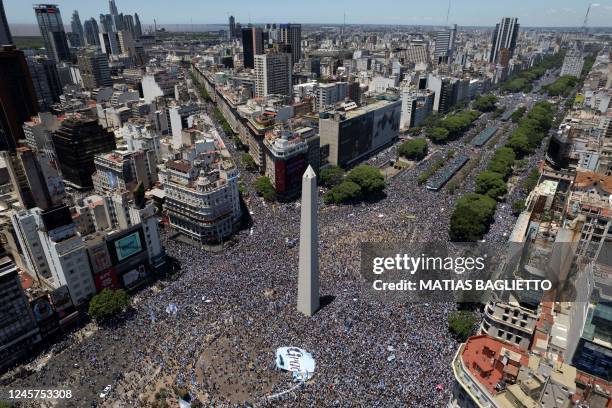 Aerial view of fans of Argentina waiting for the bus with Argentina's players to pass through the Obelisk to celebrate after winning the Qatar 2022...