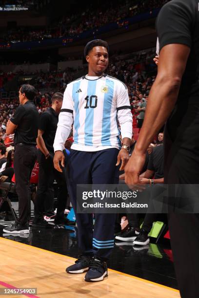 Kyle Lowry of the Miami Heat stands on the sideline wearing a Lionel Messi Argentina National Team jersey on December 20, 2022 at FTX Arena in Miami,...