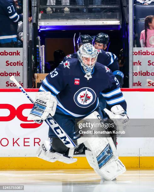 Goaltender David Rittich of the Winnipeg Jets hits the ice prior to puck drop against the Ottawa Senators at the Canada Life Centre on December 20,...
