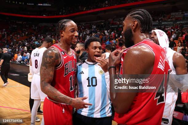 DeMar DeRozan of the Chicago Bulls and Patrick Williams talk with Kyle Lowry of the Miami Heat after the game on December 20, 2022 at FTX Arena in...